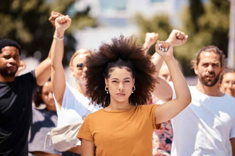 People protest for freedom, support fist for climate change or black power empowerment in Los Angel